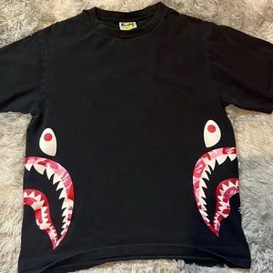 Vintage bape black graphic tee. This shirt is a men’s medium.